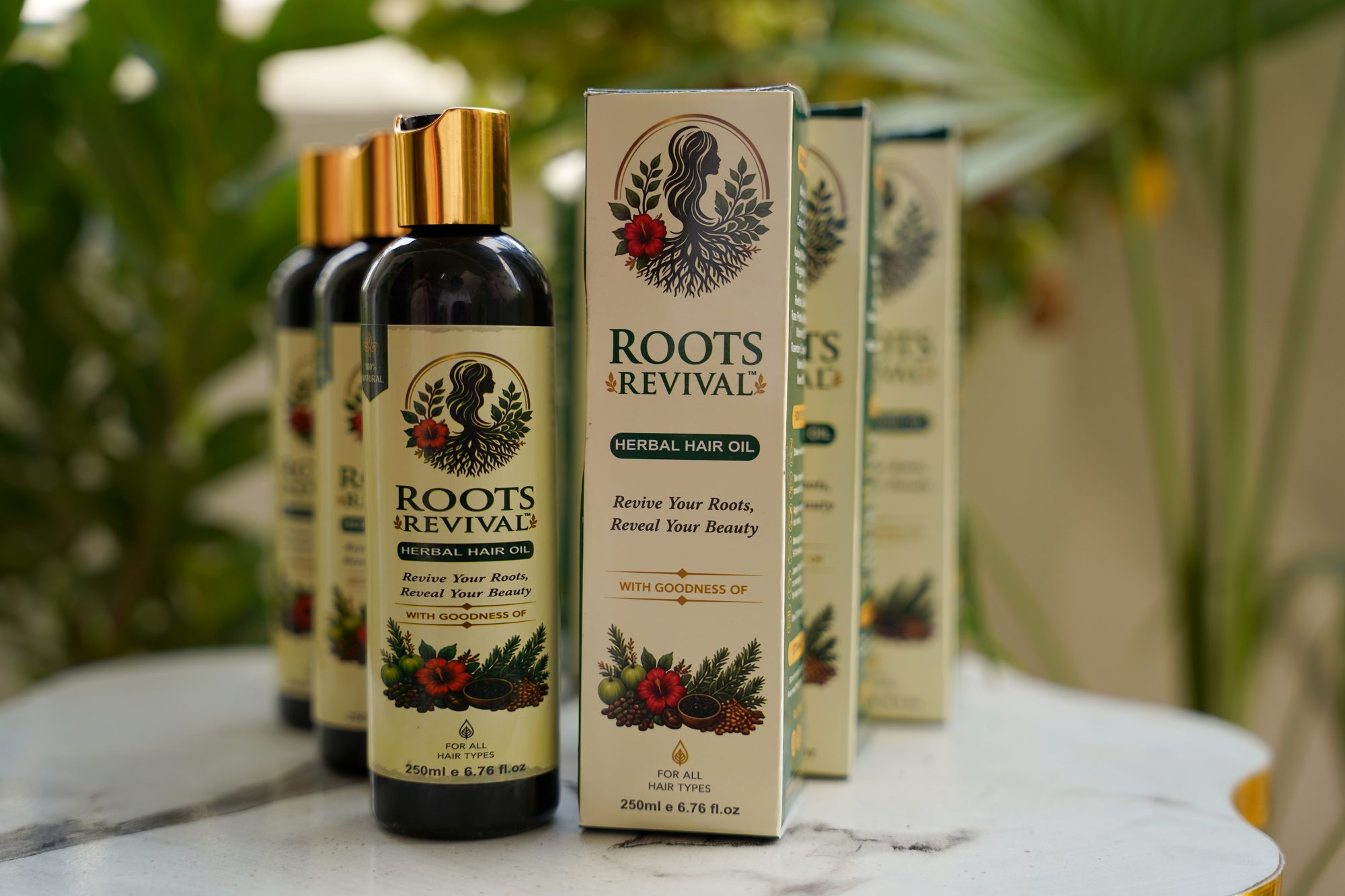 Roots Revival herbal hair oil with its printed boxes and herbs